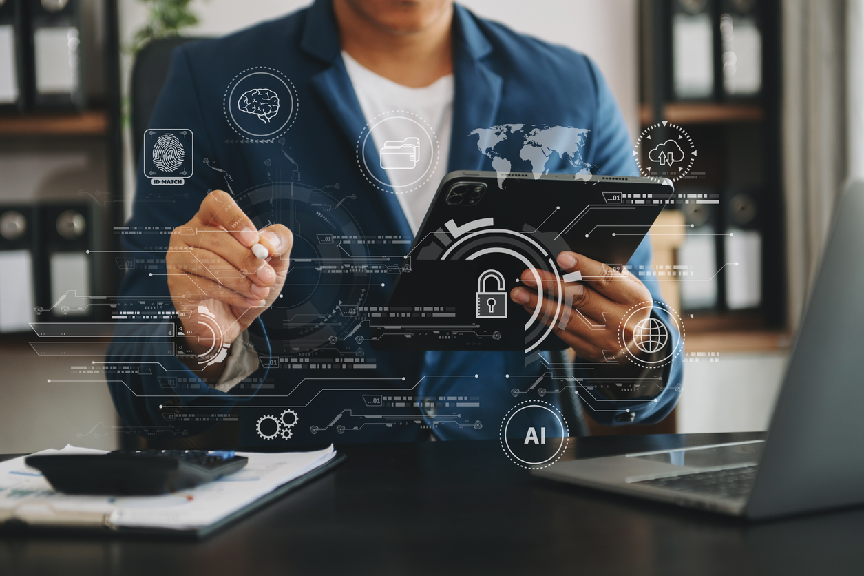 Businessman using a tablet device showing Azure migration tools to assess business systems.