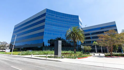 Modern glass office building in El Segundo, CA, managed IT services