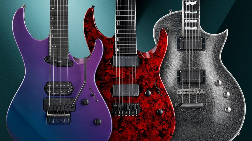 A lineup of electric guitars on a workshop wall