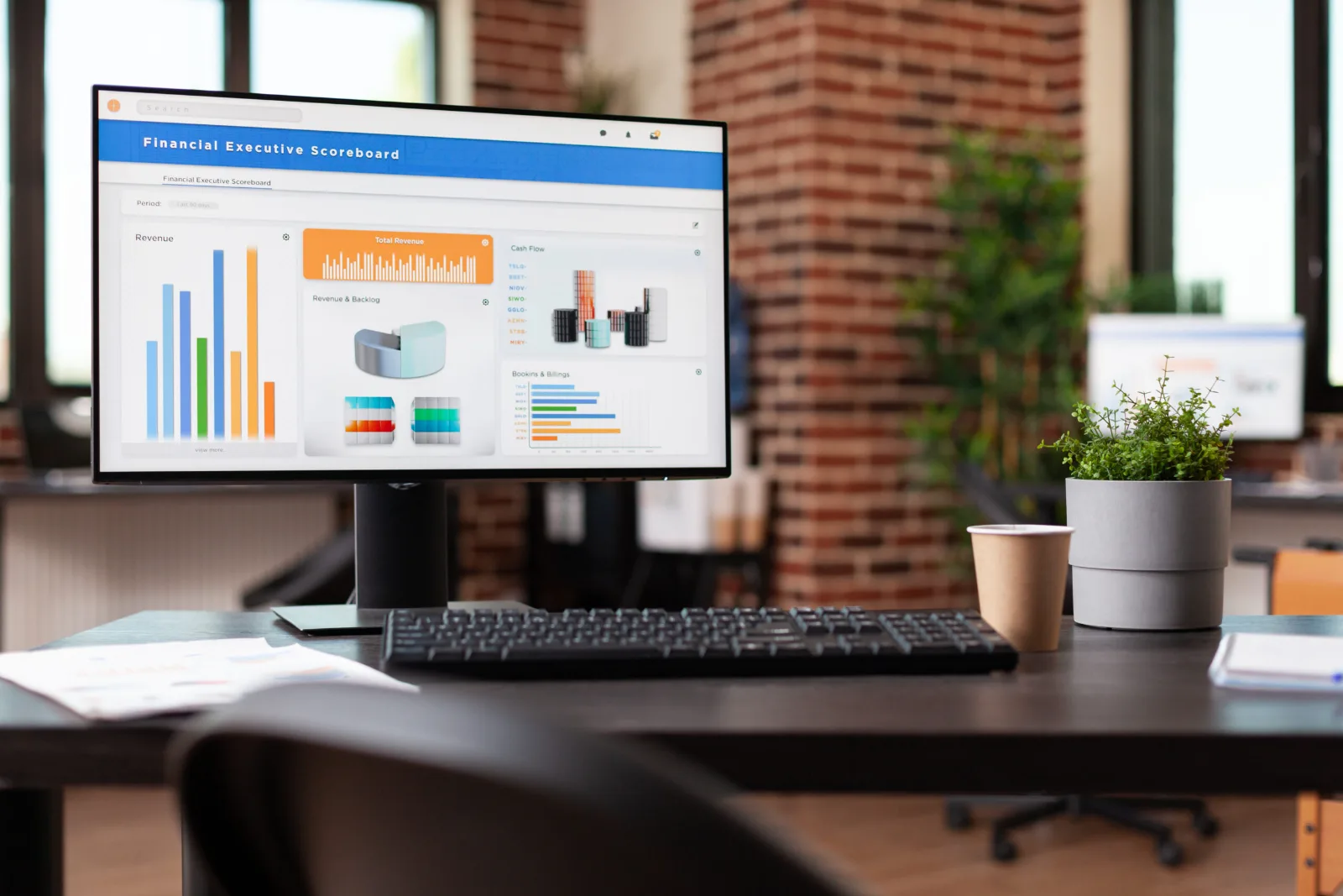 Financial reporting dashboard on a monitor supported by Frontline financial services IT