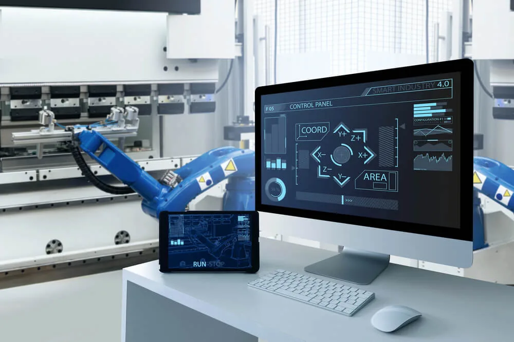 Industrial automation control panel and robotic arm on a smart-industry manufacturing line