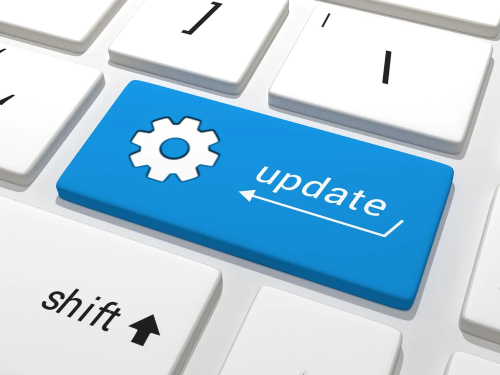 Blue update key on a keyboard representing patch and update management